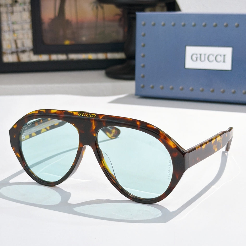Versace sunglasses, tortoiseshell frames with light blue lenses