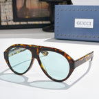 Versace sunglasses, tortoiseshell frames with light blue lenses
