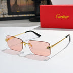 Gold-tone Cartier glasses with pink mirrored lenses and black temple tips