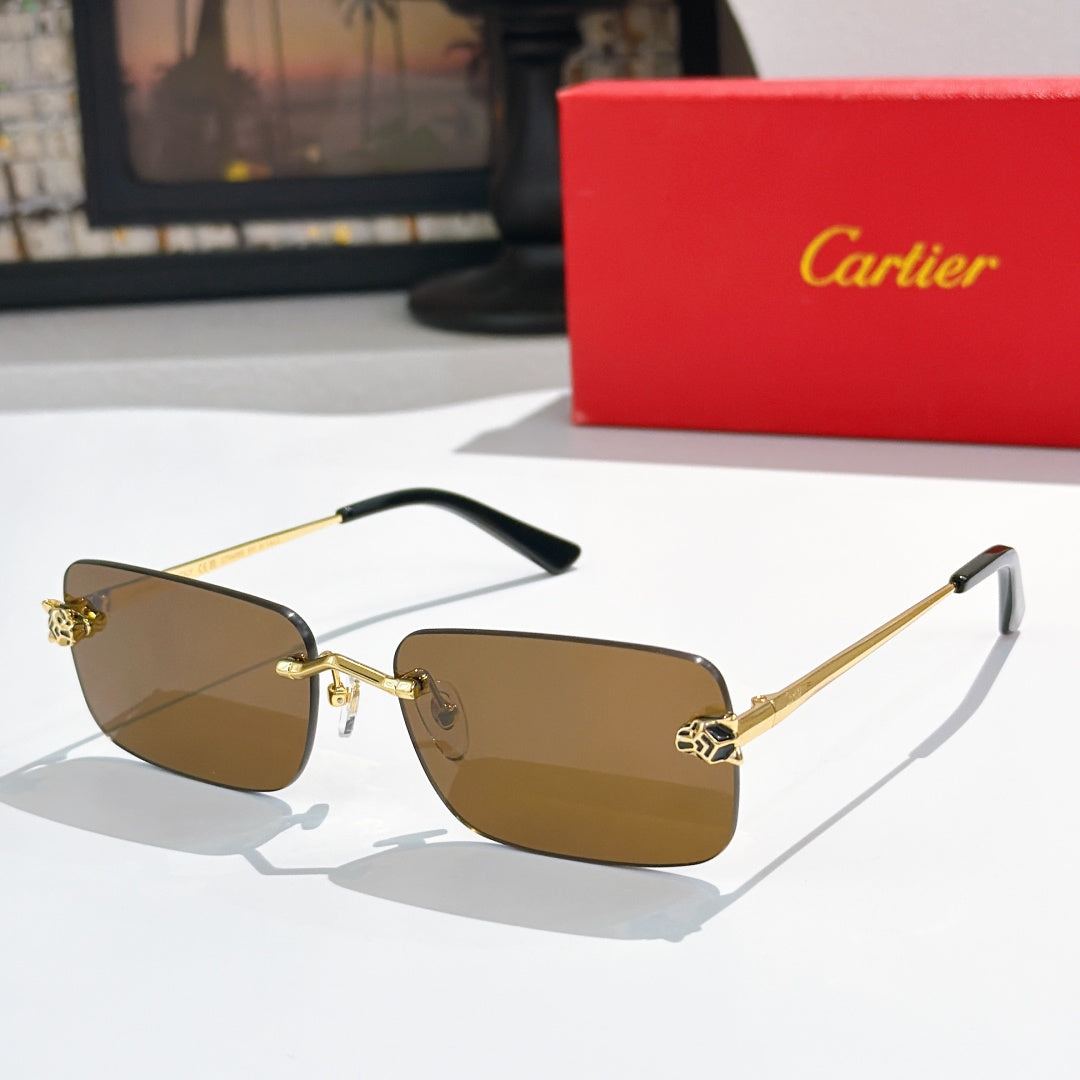 Gold-tone Cartier glasses with brown tinted lenses and black temple tips