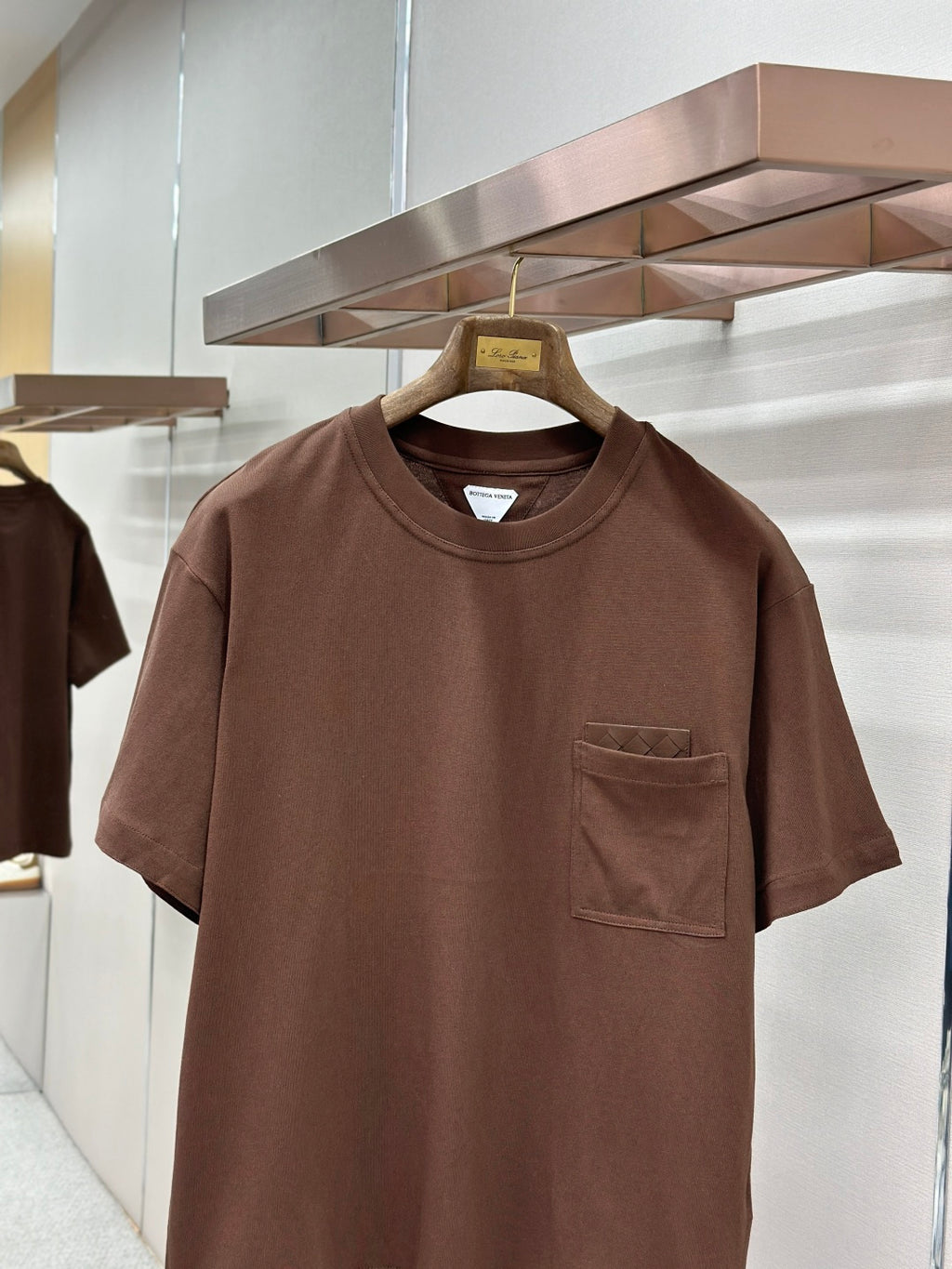 Brown crew-neck short-sleeve T-shirt with chest pocket, close front view