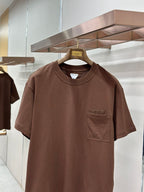 Brown crew-neck short-sleeve T-shirt with chest pocket, close front view
