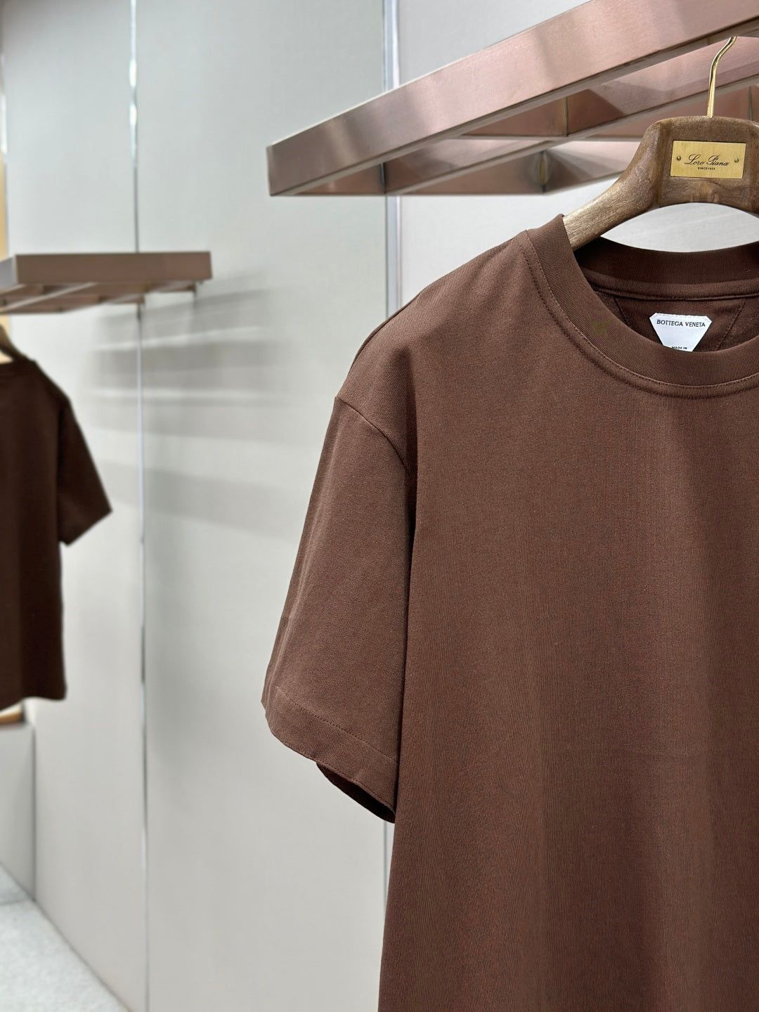 Brown crew-neck short-sleeve T-shirt neckline and chest pocket detail