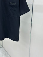 Dark navy T-shirt hem and pocket corner, short sleeves