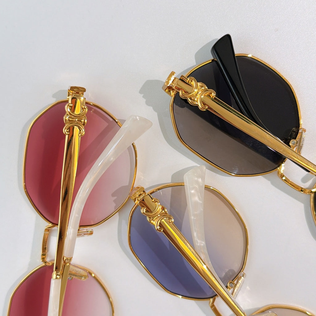 Celine sunglasses close-up, gold frames with pink and dark lenses