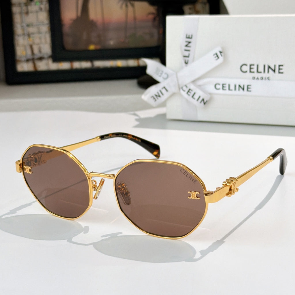 Celine sunglasses with gold frame, brown tinted lenses, decorative emblem temples