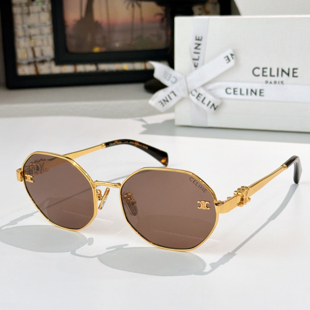 Celine sunglasses with gold frame, brown tinted lenses, decorative emblem temples