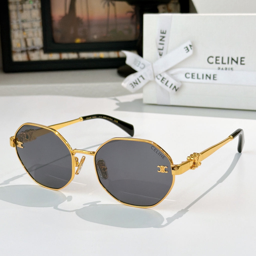 Celine sunglasses with gold frame, dark lenses, and ornate temple details