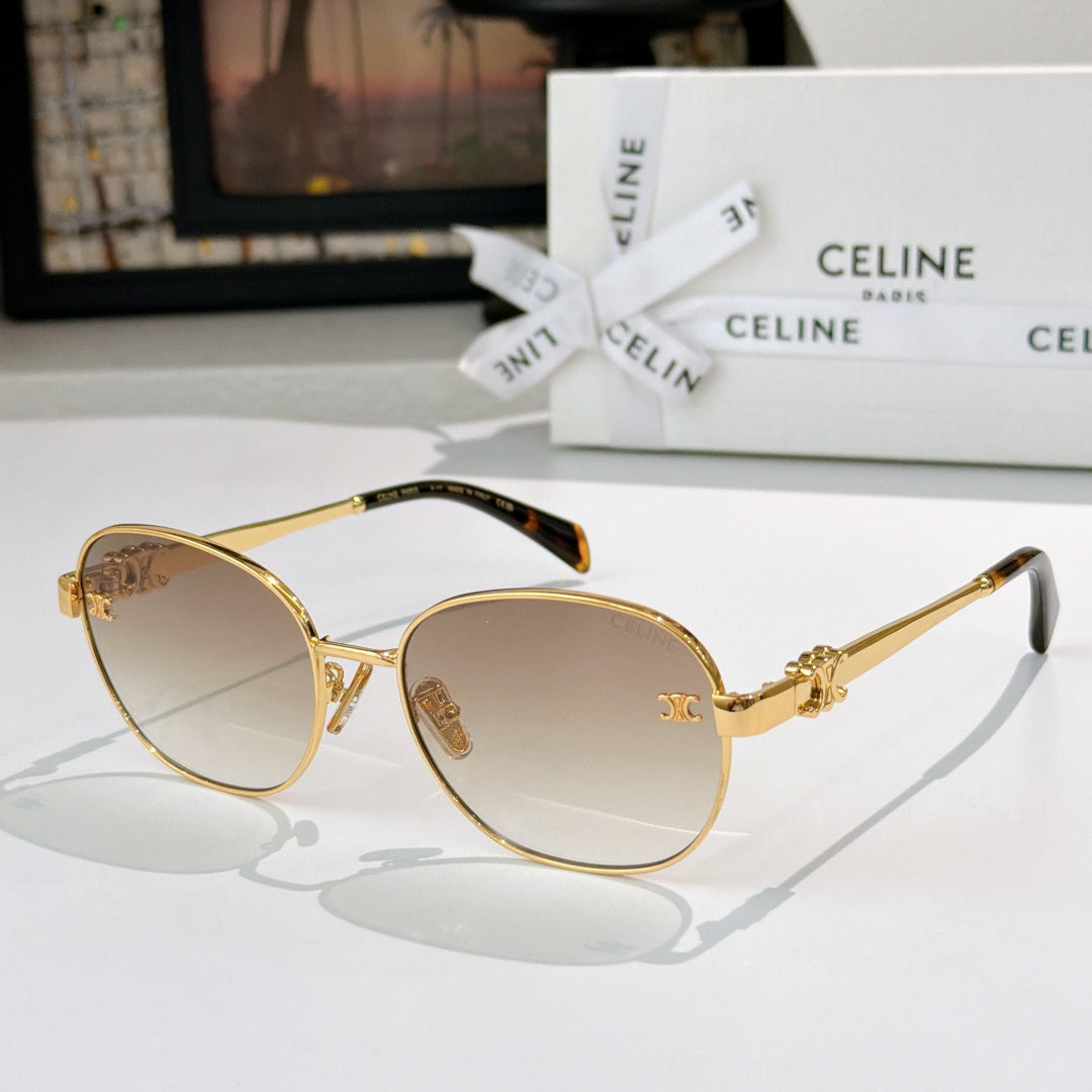 Gold-tone round sunglasses with light-pink lenses and gold emblem on temple