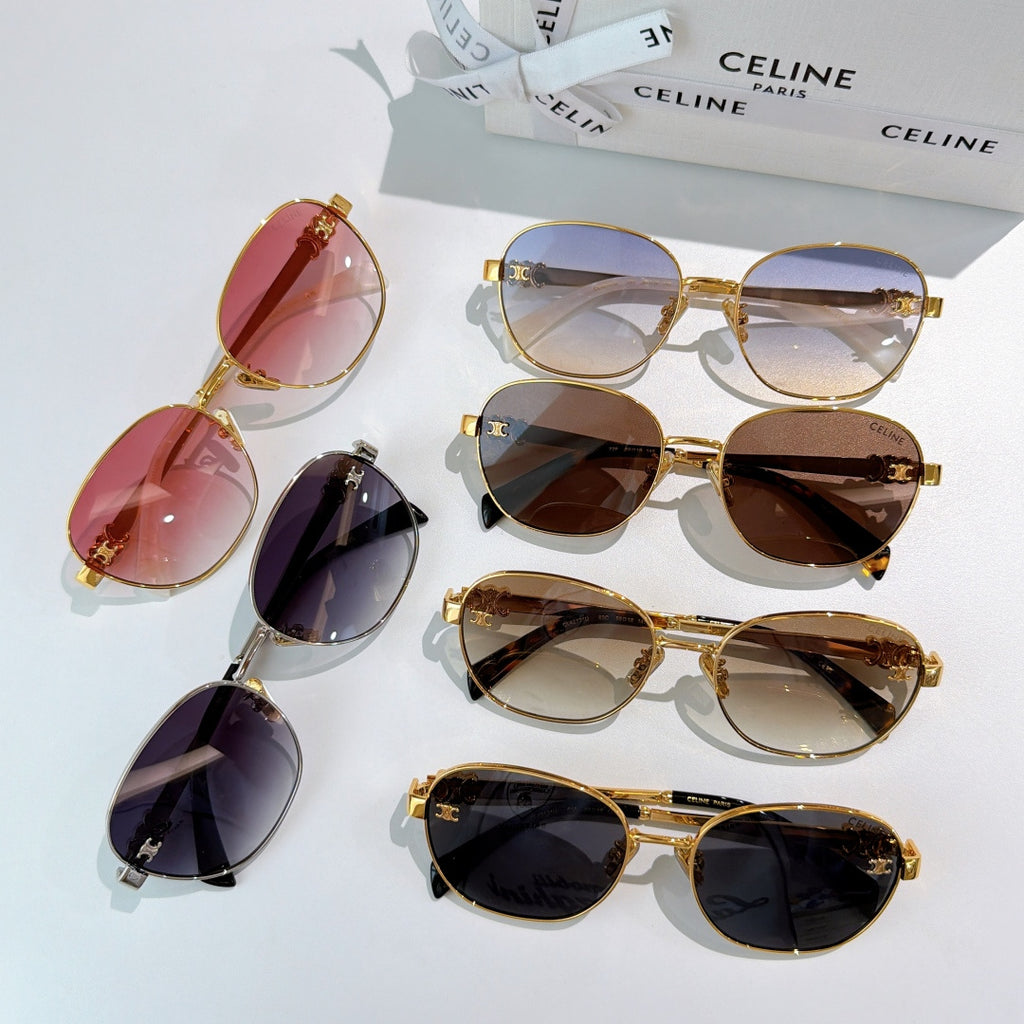 Assorted sunglasses with red, purple, brown, and black lenses, gold-tone frames