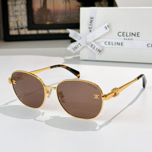 Gold-tone round sunglasses with dark lenses and small emblem on bridge