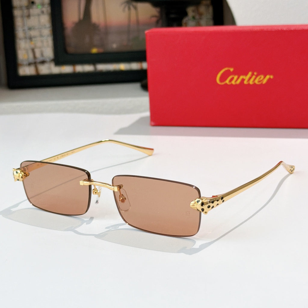 Cartier rectangular sunglasses with amber-brown lenses and gold metal frames, patterned temples