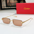 Cartier rectangular sunglasses with amber-brown lenses and gold metal frames, patterned temples