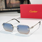 Cartier sunglasses with light blue lenses, gold bridge, and dark temples.