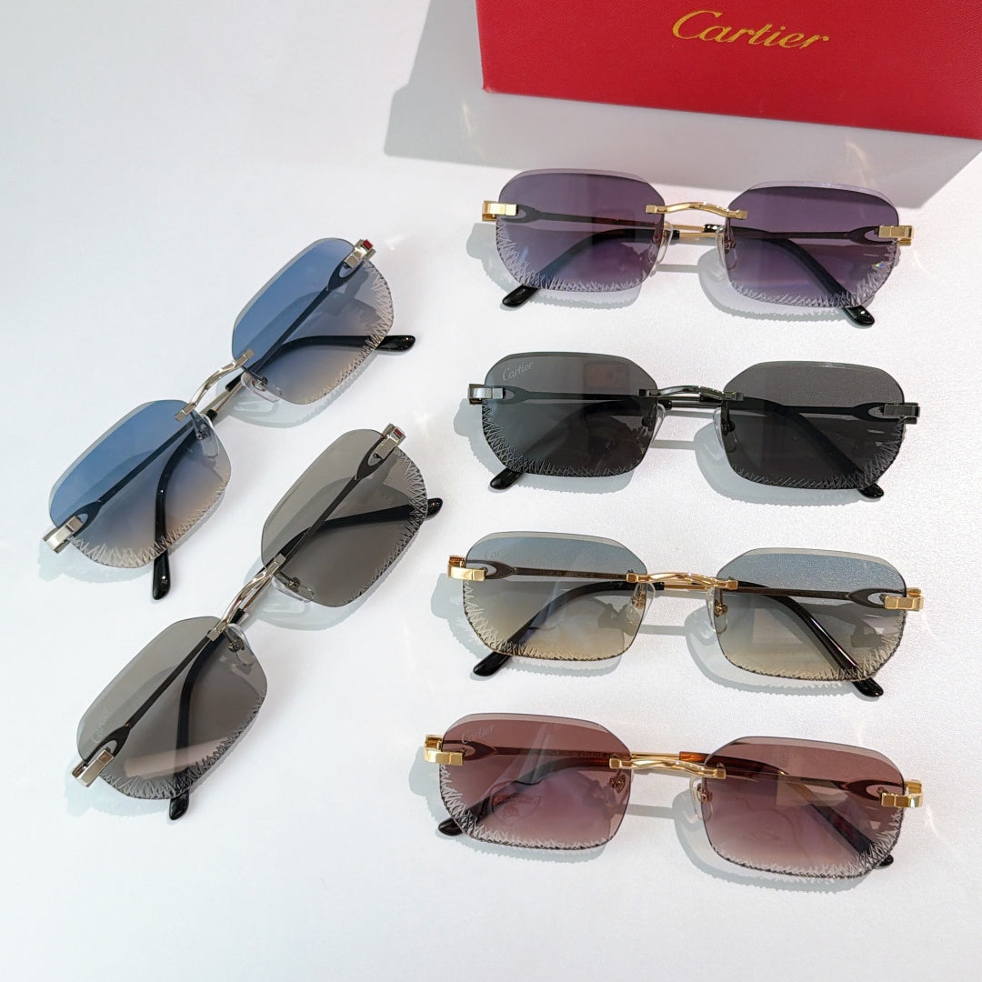 Cartier sunglasses set with mixed frames and tinted lenses laid out.