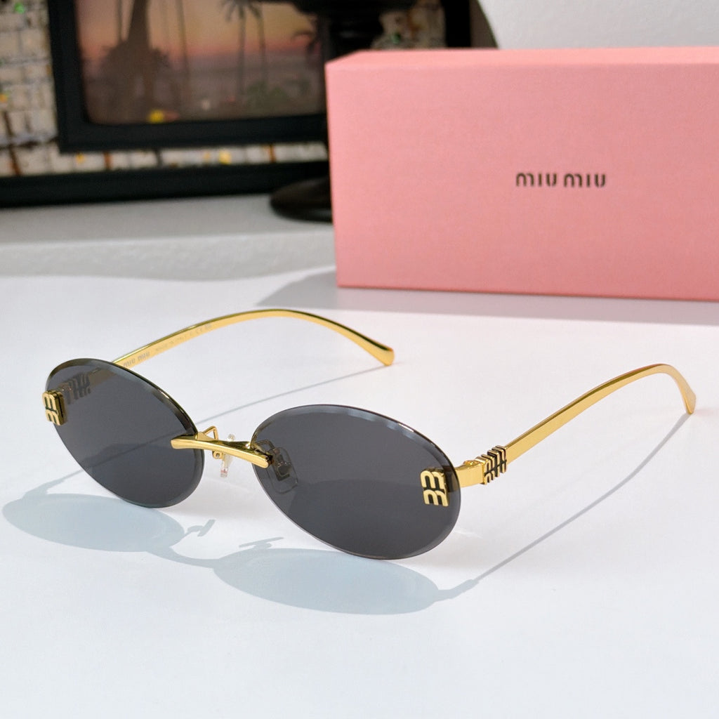 Sunglasses with gold metal round frames and dark gray gradient lenses.