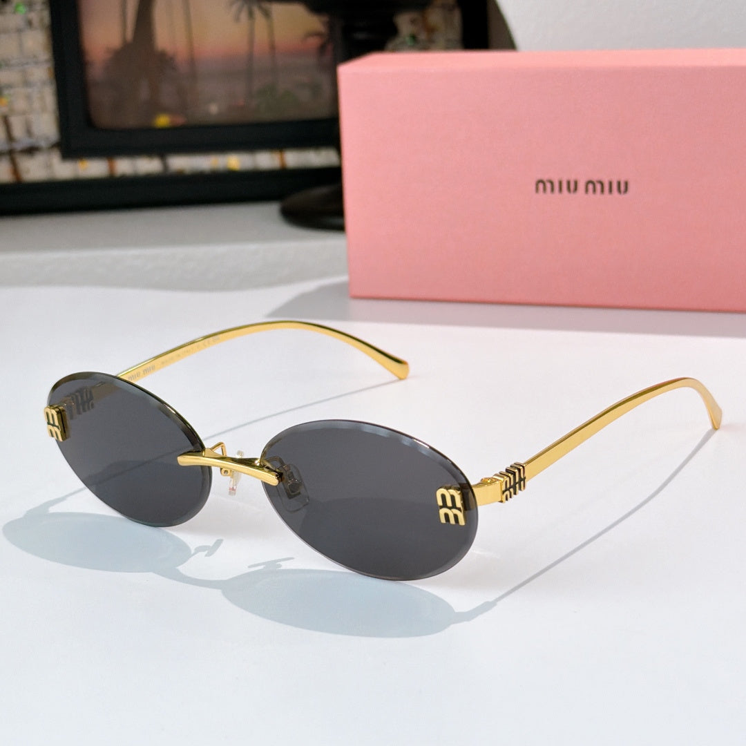 Sunglasses with gold metal round frames and dark gray gradient lenses.