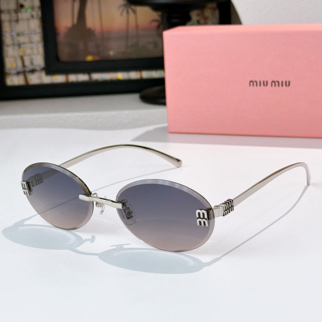 Sunglasses with gold metal round frames and slate blue gradient lenses.