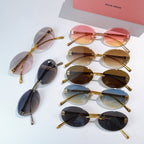 Set of sunglasses with gold metal round frames and mixed tinted lenses.