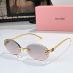 Sunglasses with gold metal round frames and light rose gradient lenses.