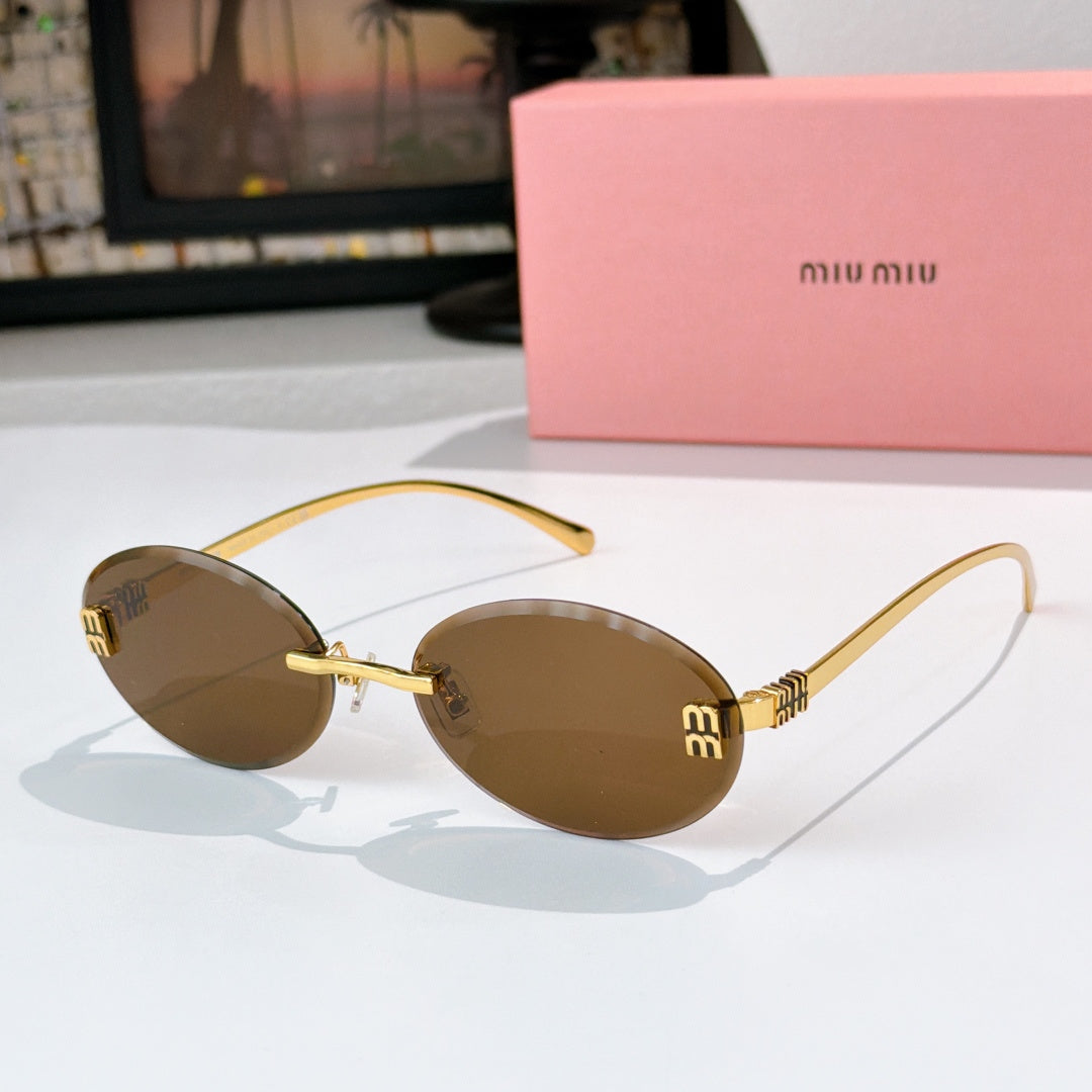 Sunglasses with gold metal round frames and dark brown gradient lenses.