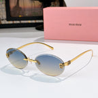 Sunglasses with gold metal round frames and light blue gradient lenses.