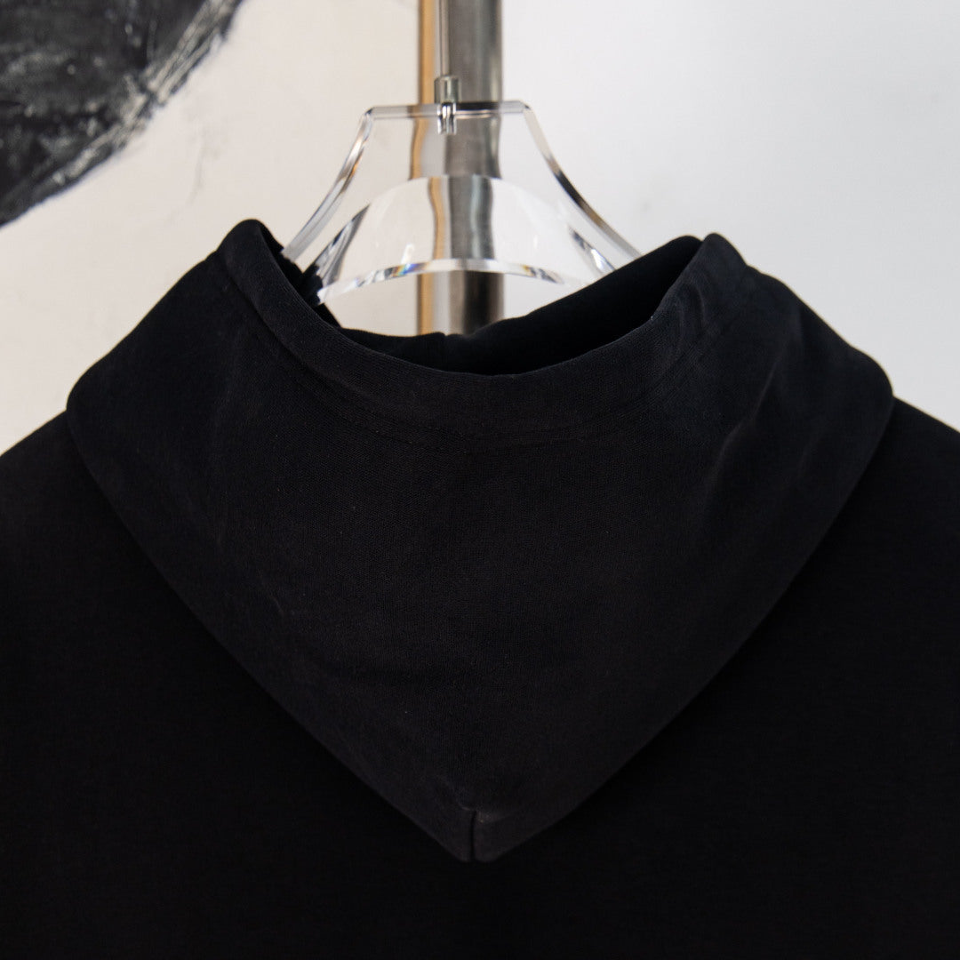 Black hooded sweatshirt with front kangaroo pocket and drawstring hood