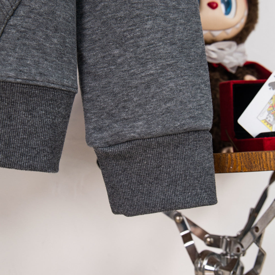 Dark heather gray sweatshirt sleeve and ribbed cuff