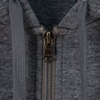 Zip-up hoodie front with metal zipper pull and hood opening