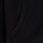 Black hoodie side pocket with curved seam detail