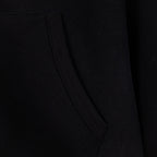 Black hoodie side seam and stitched pocket opening