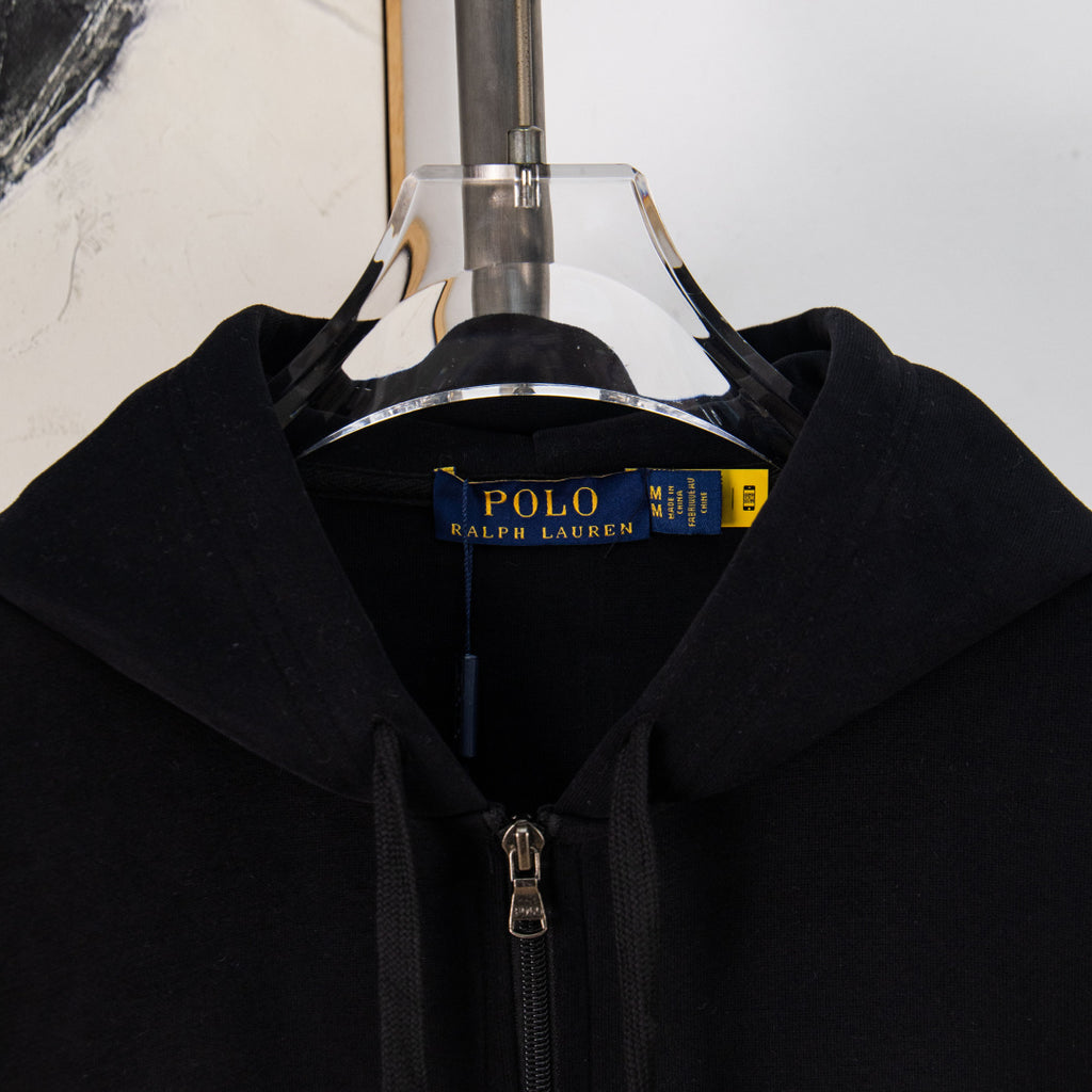 Black zip-front hoodie with hood and front zipper shown on hanger
