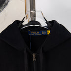 Black zip-front hoodie with hood and front zipper shown on hanger