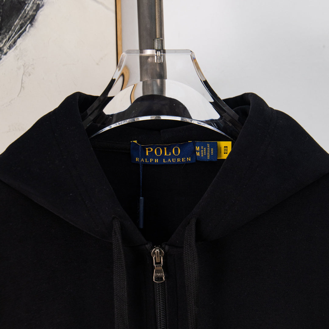 Black zip-front hoodie with hood and front zipper shown on hanger