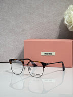 MiuMiu eyeglasses with tortoiseshell and black full-rim frame, clear lenses