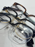 Set of MiuMiu eyeglasses with multiple full-rim frames and clear lenses