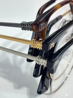 MiuMiu eyeglasses close-up of temple hinges with gold and silver-tone hardware