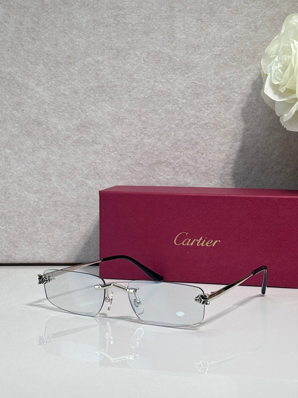 Metal-framed eyeglasses with clear lenses and black temples