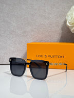 Louis Vuitton sunglasses with dark tortoiseshell frames and gold chain temple detail