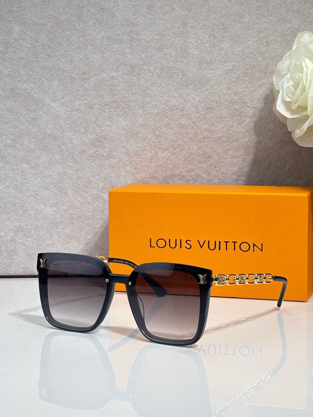 Louis Vuitton sunglasses in dark tortoiseshell with gold hardware and square lenses