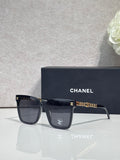 CHANEL sunglasses with dark lenses and gold chain-style temple accents