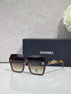 Chanel sunglasses with dark brown tortoise-effect square frames and gold-tone logo