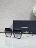 Chanel sunglasses with dark navy square frames and gold-tone logo hardware
