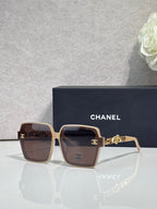 Chanel sunglasses with brown square frames and gold-tone logo hardware