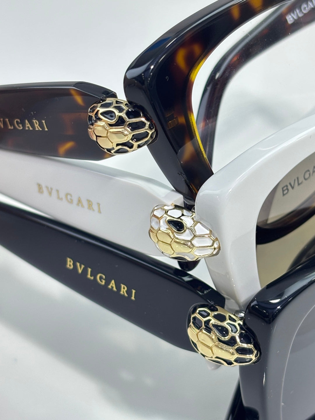 Bvlgari glasses, gold-tone hinge with blue enamel lion detail on dark arms