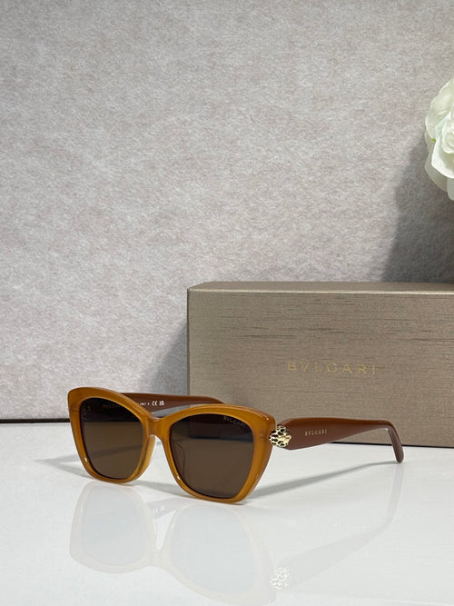 Bvlgari sunglasses, tortoiseshell frame with dark lenses and gold bridge emblem