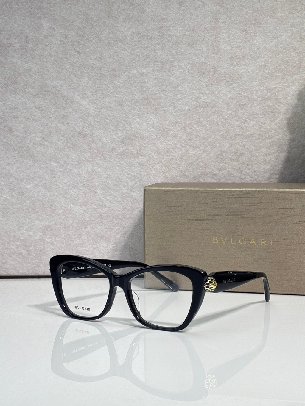 Bvlgari eyeglasses, black frame with clear lenses and gold temple emblem