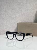 Bvlgari eyeglasses, black frame with clear lenses and gold temple emblem