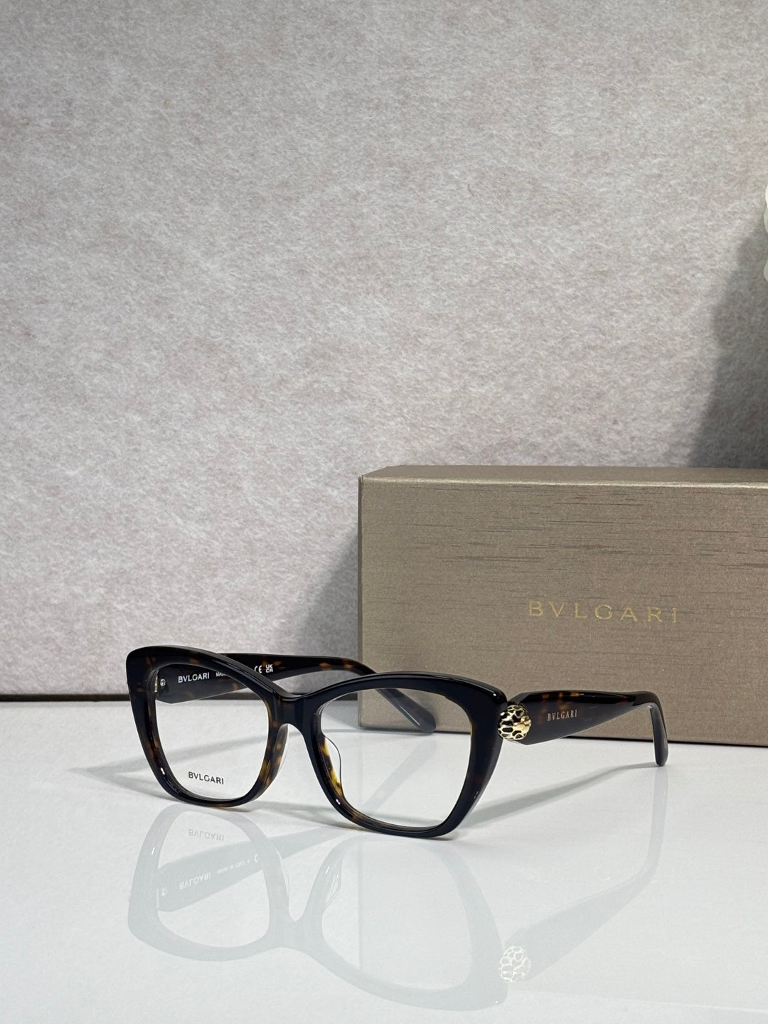 Bvlgari eyeglasses, black frame with clear lenses and gold side emblem