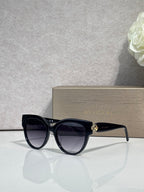 Bvlgari round cat-eye sunglasses with dark frame and black tinted lenses